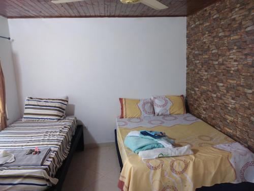 Ein Bett oder Betten in einem Zimmer der Unterkunft Casa Puerto Triunfo Dann