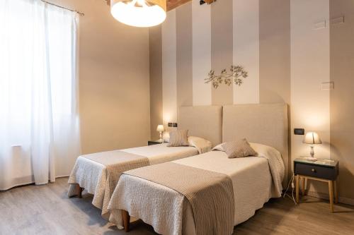 Postel nebo postele na pokoji v ubytování B&B Stella Lucca