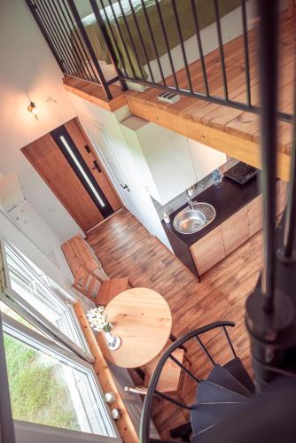 an overhead view of a room with a table and a kitchen at Zimna Apartments in Kwidzyn