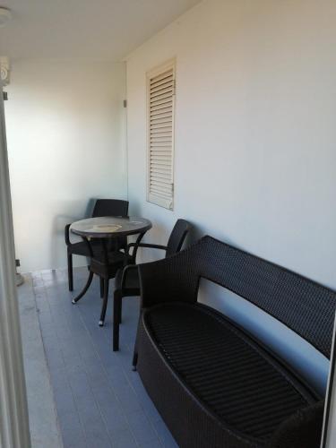 a living room with a couch and a table at Hotel Tiffany in Varcaturo
