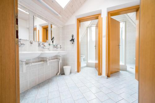 a bathroom with a sink and a toilet at Hostel Kronotop in Triglav National Park in Log pod Mangartom