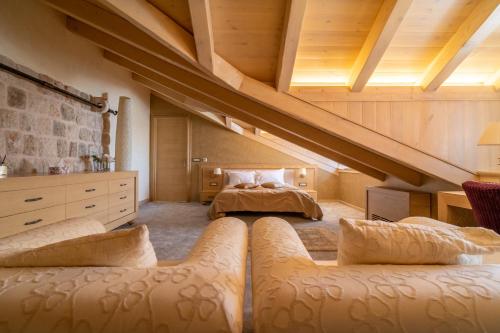 a bedroom with two beds and an attic at Villa Revelin Dubrovnik Old Town in Dubrovnik
