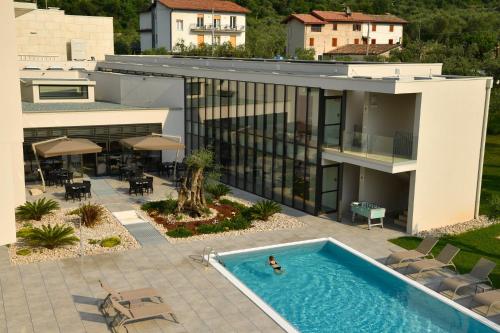 an aerial view of a house with a swimming pool at Residence Malcesine-Active&Family in Malcesine