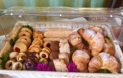 a plastic container filled with different types of pastries at Villa Franci in Santa Teresa Gallura