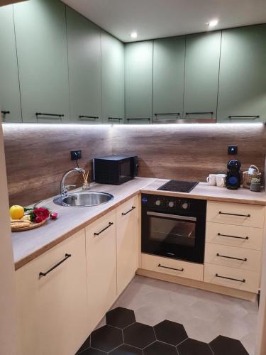 Dapur atau dapur kecil di Kamelia guest rooms