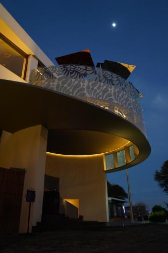 a building with a bed on top of it at night at Cartesiano Boutique & Wellness Hotel in Puebla