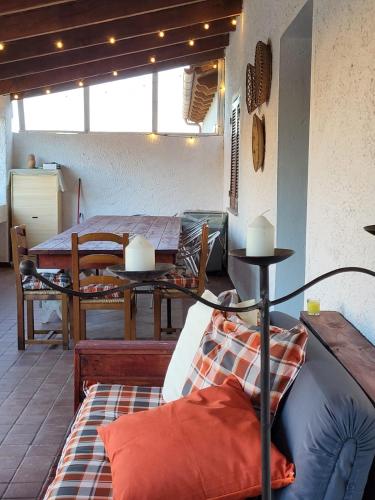 a living room with a table and a couch at Casa Twins in Sassari