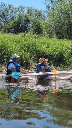 two people in kayaks on a body of water at Kaimo turizmo sodyba Geras in Leliūnai