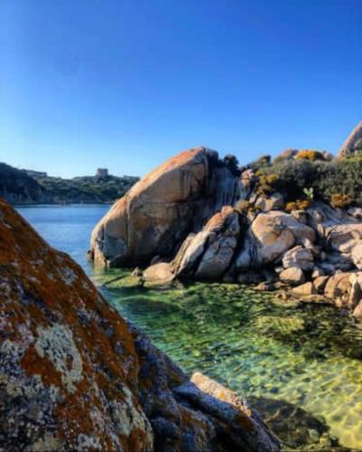 a group of large rocks in the water at Villa Franci in Santa Teresa Gallura