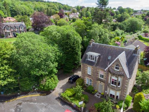 an aerial view of a house with a car in the driveway at Annfield House, Callander in Callander
