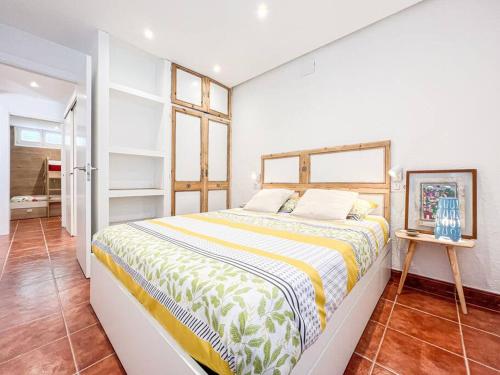 a bedroom with a large bed in a room at Apartament 'Es Botànic' in Blanes