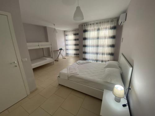 A bed or beds in a room at Merville Apartment 3