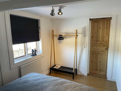 a bedroom with a bed and a window at Swedish Adventure in Brograngen