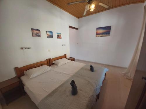 Postel nebo postele na pokoji v ubytování Theo Apartments