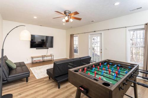 a living room with a pool table at Spacious Family Friendly Home Near Massanutten and National Park in McGaheysville