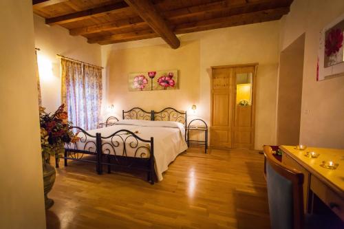 Postel nebo postele na pokoji v ubytování Hotel Alla Corte dei Bicchi
