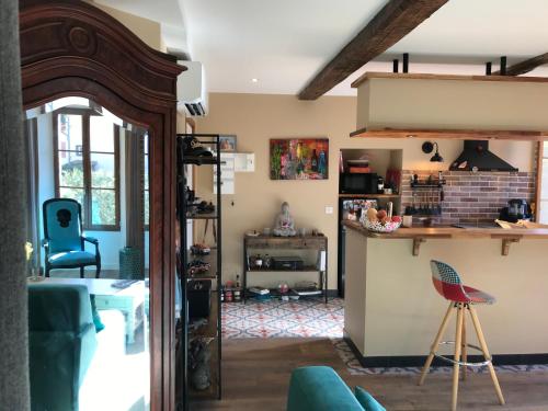 a living room with a couch and a table at La LAZARENCO in Plan-de-la-Tour