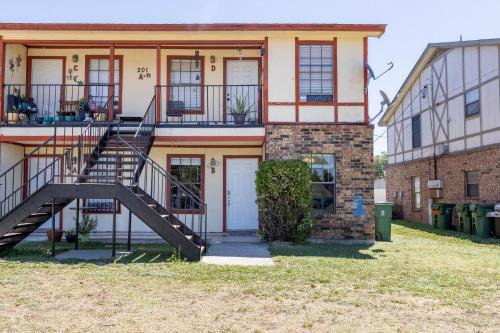a house with a staircase in front of it at Congeniality and Comfort. All the essentials with class, 2 nights? 2 weeks? Stay, relax, work, or go out for fun. in Arlington