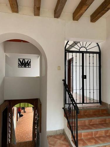 an entrance to a building with a wrought iron gate at Casa Ceiba/Dpto. entero cerca del Centro Histórico in Oaxaca City