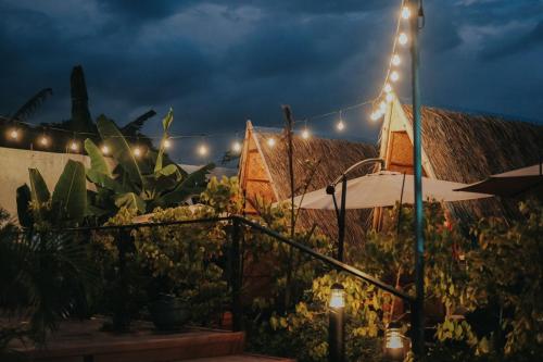 a garden with lights on the side of a building at Urban Oasis Resort, Tarlac in Tarlac