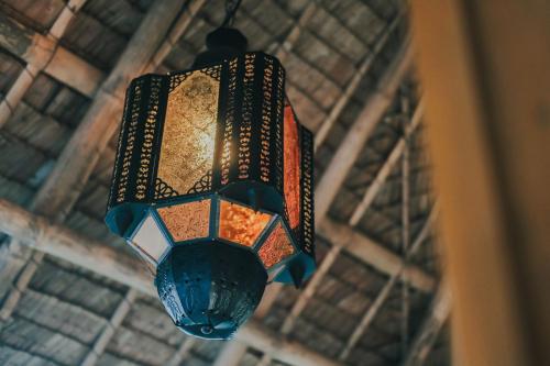 a close up of a light hanging from a ceiling at Urban Oasis Resort, Tarlac in Tarlac