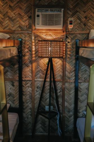 a room with a fan and a tripod with a camera at Urban Oasis Resort, Tarlac in Tarlac