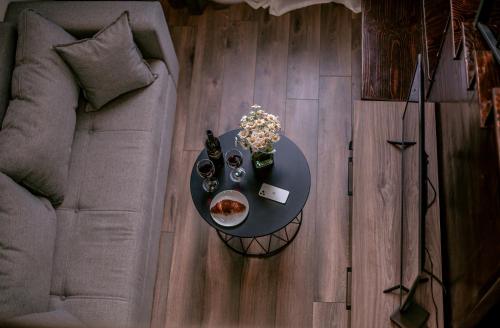 an overhead view of a table with food and a couch at Luxury Duplex Suites - City Center in Tbilisi City