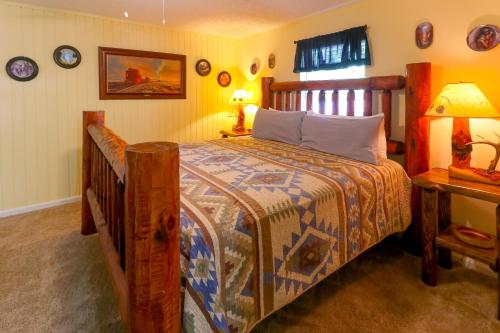 a bedroom with a large bed with a wooden frame at Little Bear Retreat 1 in Helen