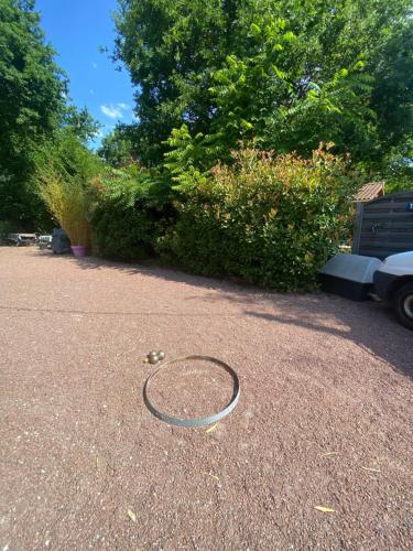 a racket laying on the ground in a parking lot at Villa piscine chauffée & spa sur le Bassin d Arcachon - proche plage et océan in Lanton
