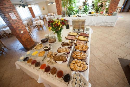 a table with many different types of food on it at Farina Park Hotel in Bento Gonçalves