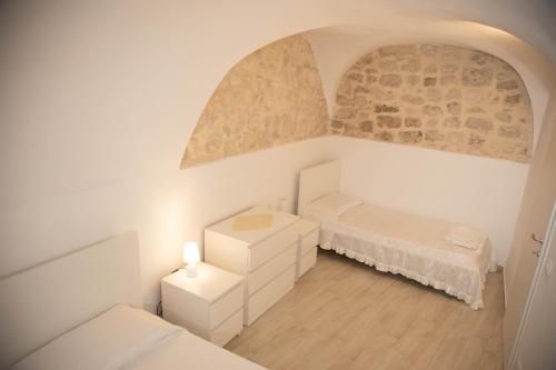 Ένα ή περισσότερα κρεβάτια σε δωμάτιο στο Casa di Gio