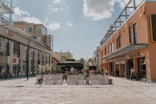 a cobblestone street in a city with buildings at West Coast Hideaway in Pietarsaari