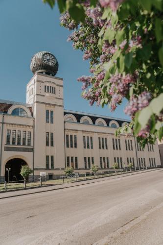 a building with a clock tower on top of it at West Coast Hideaway in Pietarsaari