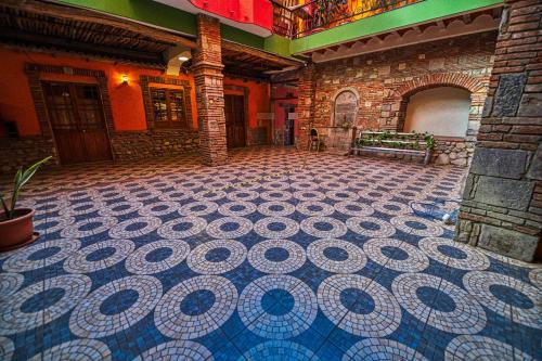 a room with a tiled floor in a building at ISKAY BOUTIQUE HOSTEL in La Paz