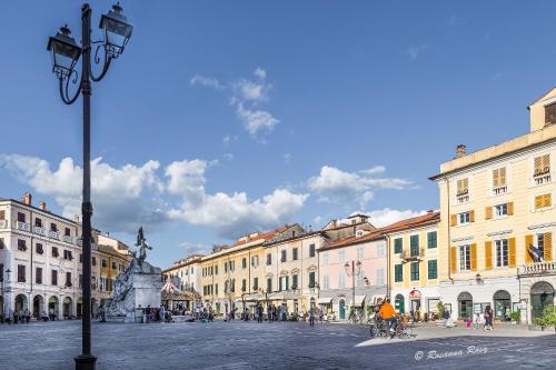 a city square with buildings and a street light at IL NIDO DI CHLOE cod. citra 011027-LT-0239 in Sarzana