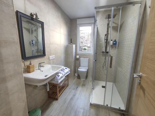 a bathroom with a sink and a shower at CASA RURAL PAJARICA en Sanabria in San Ciprián