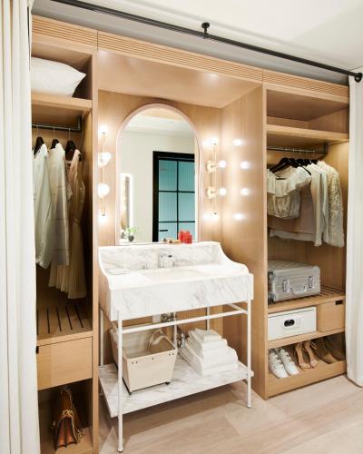 a bathroom with a sink and a large mirror at Virgin Hotels New Orleans in New Orleans