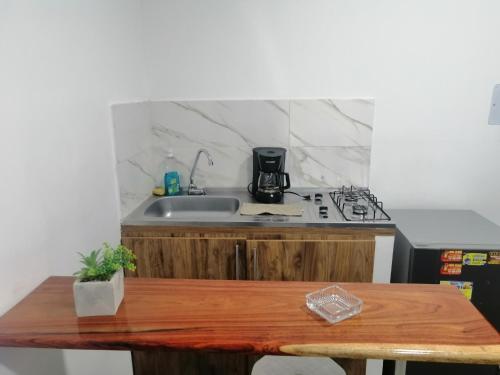 Kuchyň nebo kuchyňský kout v ubytování CASA HOTEL QR