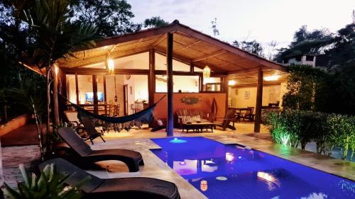 Πισίνα στο ή κοντά στο Beach House Prumirim
