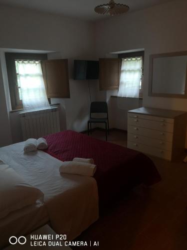 En eller flere senge i et værelse på Mulini di Verrucole