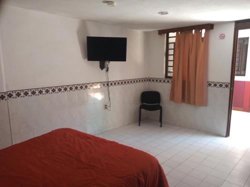Postel nebo postele na pokoji v ubytování Hotel San Diego