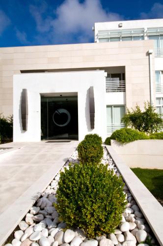 a house with a driveway and a building at Lavanda Hotel Miravillas in Praia de Mira