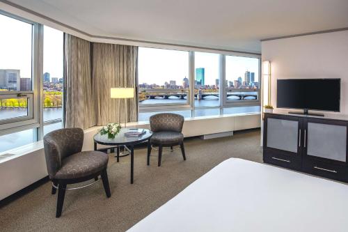 a hotel room with a bed and a television at The Royal Sonesta Boston in Cambridge