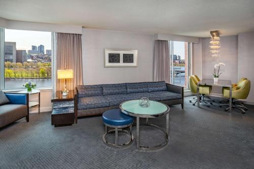 a living room with a couch and a table at The Royal Sonesta Boston in Cambridge