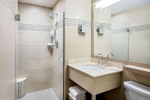 a bathroom with a sink and a shower at The Royal Sonesta Boston in Cambridge
