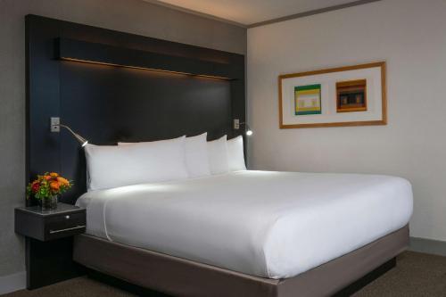 a large white bed in a hotel room at The Royal Sonesta Boston in Cambridge
