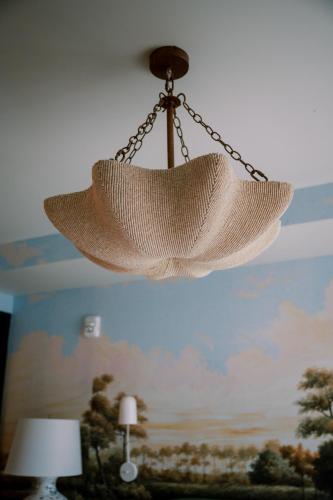 a net chandelier hanging from a ceiling at Virgin Hotels New Orleans in New Orleans