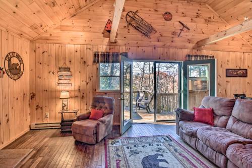 a living room with a couch and chairs in a cabin at Natures Retreat with Hot Tub 7 Mi to Bryson City in Whittier