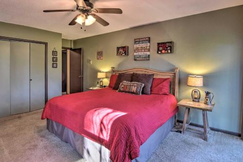 a bedroom with a bed and a ceiling fan at Natures Retreat with Hot Tub 7 Mi to Bryson City in Whittier