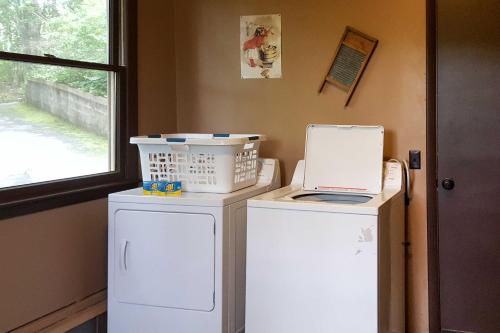 a kitchen with two refrigerators and a laptop on top at Natures Retreat with Hot Tub 7 Mi to Bryson City in Whittier